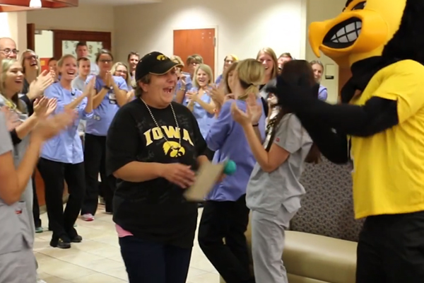 Patient celebrating in clinic