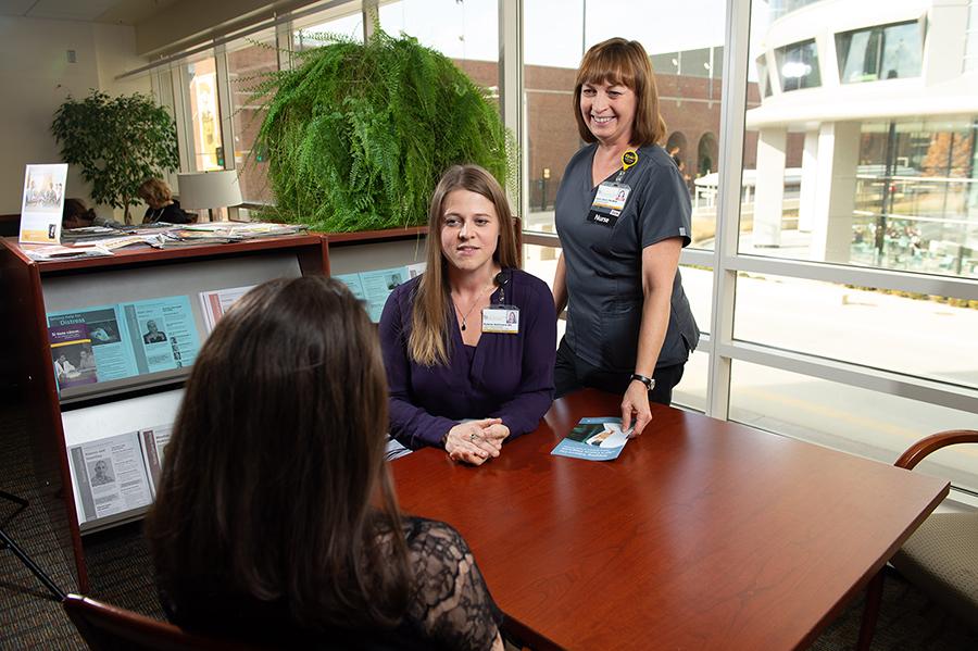 Care team members talk with a patient about their tobacco treatment plan